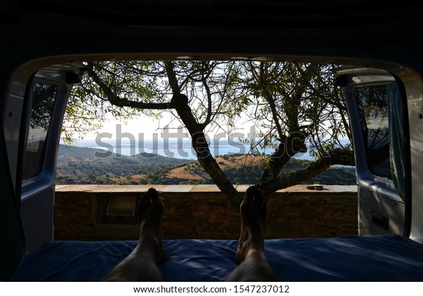 Inside a campervan looking at nice landscape of\
Monsaraz in Alentejo,\
Portugal