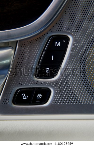 inside car door lock buttons and driver seat\
memory buttons