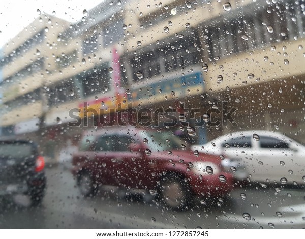 Inside car with rainy\
day.