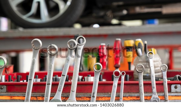 Inside the car
service center with
Spanner