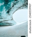 Inside Castner Glacier in Delta Junction, Alaska. The icy cave’s textured blue walls open to a snow-covered landscape, capturing Alaska’s raw and mystical beauty.