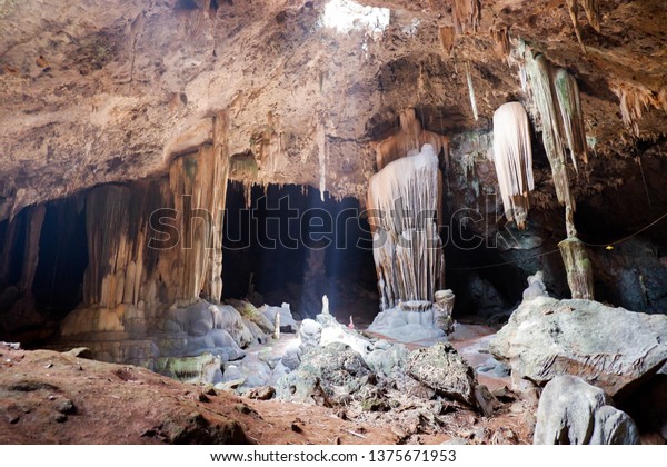 Inside the cave , stalagmite ,The light passes into\
the cave on top of the\
hole.