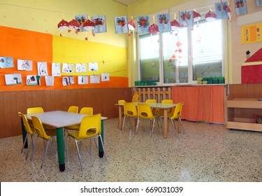 Inside A Classroom Of A Kindergarden Without People And Many Decorations In The Wall