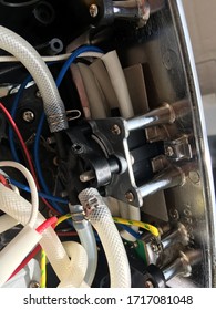 inside the coffee machine. repair of coffee makers. inside of the coffee machine. wires and hoses.