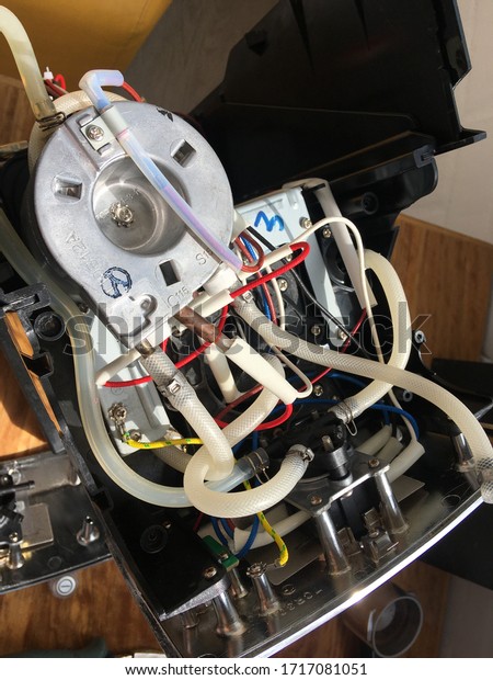 inside the coffee machine.\
repair of coffee makers. inside of the coffee machine. wires and\
hoses.