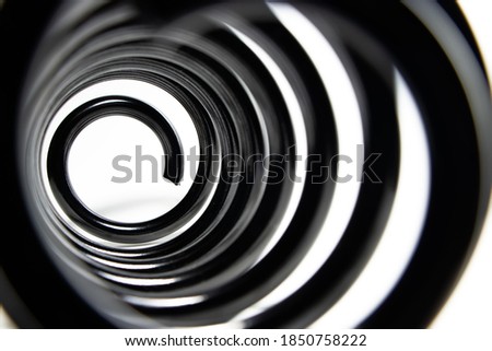 Inside the coiled metal springs on white.