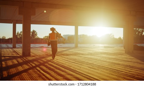 Inside of the Commercial / Industrial Building Construction Site: Engineer Surveyor Finishes Day's Job Carries Tripod Theodolite and Walks into the Sunset. In Background Skyscraper Formwork Frames - Shutterstock ID 1712804188