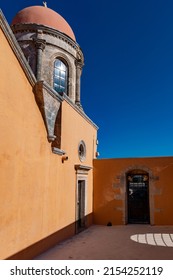 Inside courtyard of Greek monastery in strong sunshine