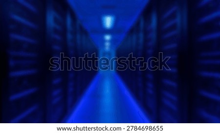 Inside a data center server room with rows of servers and blue lighting. The background is blurred, creating a sense of depth and speed.