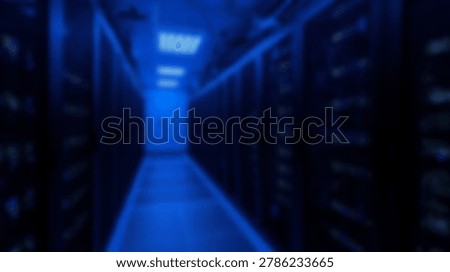 Inside a data center server room, rows of server racks are illuminated by blue lighting, creating a futuristic atmosphere. The image showcases technology and data storage.