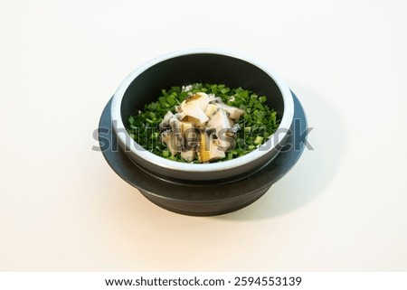 Inside the earthen pot, Abalone Rice in Stone Pot