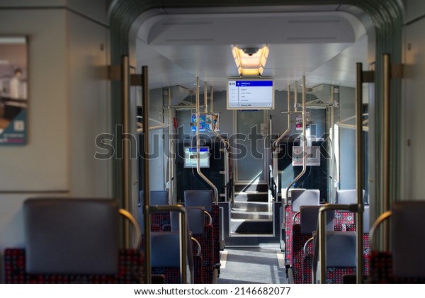 Inside of an empty\
red train of SZU transport company with display screen at terminal\
station named Uetliberg on a spring day. Photo taken April 14th,\
2022, Zurich,\
Switzerland.