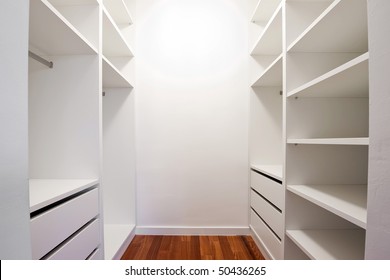 Inside Of The Empty White Walk-in Wardrobe