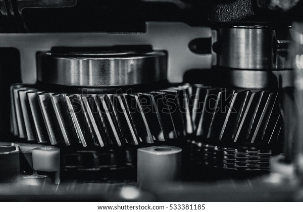 inside engine metal gear black and white color\
tone with grain texture