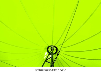inside an exposed lime-green umbrella