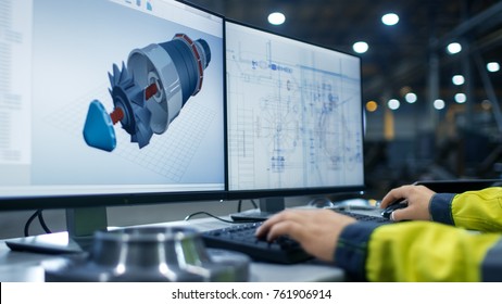Inside the Heavy Industry Factory Close-up Footage of  Industrial Engineer's Hands Working on the Personal Computer with Two Monitors Designing Turbine/ Engine in 3D, Using CAD Program.