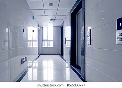 Inside the high-rise residential building in the civil building, the sun shines through the windows. - Shutterstock ID 1065380777