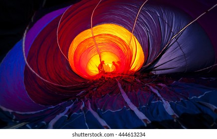 Inside Hot Air Balloon With People Outside.  Colorful Canopy Creates Silhouettes Of People Outside Balloon.