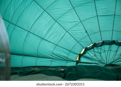 inside hot air balloon while on the ground inflating ready for flight take off for fun aerial recreation transport activity to begin