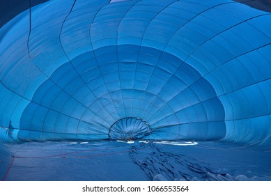 Inside Of A Hot Air Baloon That Rises From The Gorund.