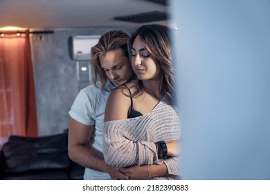 Inside House Couple Shooting Dancing In Living Room In Serious Way With Eyes Closed - Yellow And Blue Light. Lovers Shot Dance Flirting Enjoying The New House Studio With Red Courtain