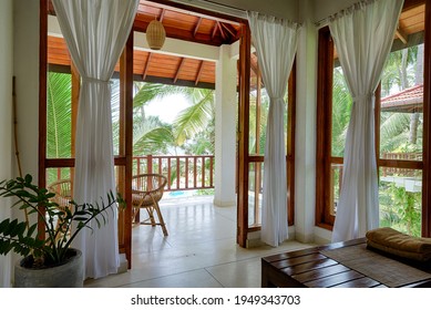 Inside House On Tropical Beach, Room With Terrace, Windows And Palm Trees View. Bungalow Interior In Indian Style. Resort Apartment, Vacation, Travel, Tourism Theme. Tangalle, Sri Lanka - Nov 2, 2017