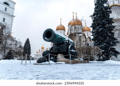 Inside Kremlin's wall - Tsar pushka with Ivan the Great Bell Tower, Ivan the Great Bell and the Dormition Cathedral background in Cathedral Square Moscow Russia.