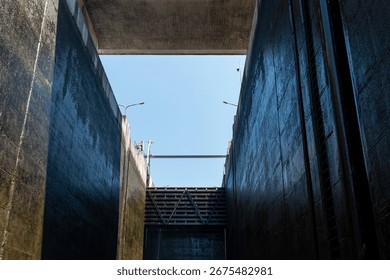Inside a lock or floodgate, where large boats ascend and descend upstream or downstream