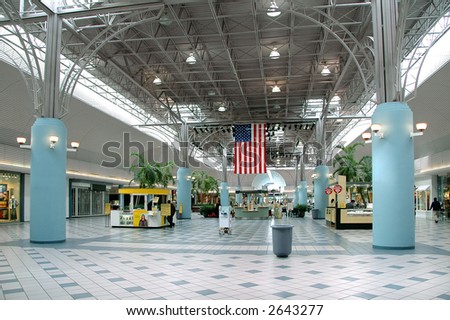 Inside a mall with american flag