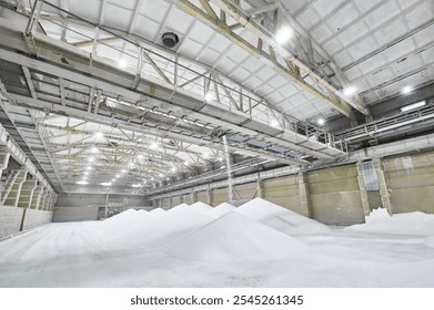 Inside a modern chemical warehouse featuring conveyor systems and stored materials in an industrial setting - Powered by Shutterstock