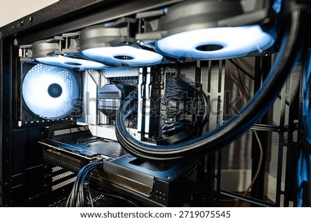 The inside of a modern computer assembled in 2025, showing DDR5 memory and other components.