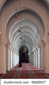 Inside A Mosque With Muslim Man Kneeling Praying