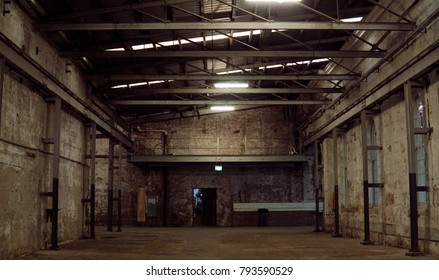 Inside Of Old Abandon Factory. A Structure Interior Of Industry Warehouse. An Abandon Old Factory With No Equipment And Machine. Image Of Rustic Factory Room Structure Made From Iron And Steel.