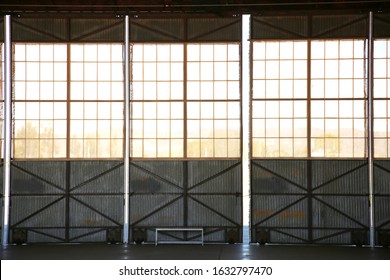 Inside An Old Airplane Hanger. Airplane Hanger Windows And Sliding Doors. 
Inside Of A Airplane Hanger For Storage And Events Or Projects, 