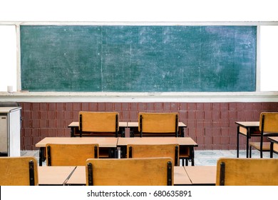 Inside The Old Classroom With Blackboard, Desks And Chairs.