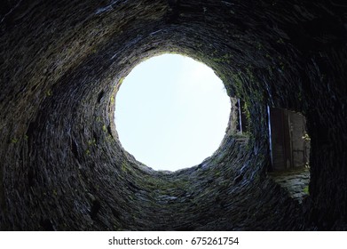 inside an old derelict castle tower - Shutterstock ID 675261754