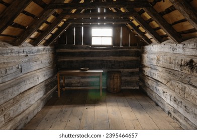 Inside of an old fashioned American log cabin in the Ulster American Folk Park, Northern Ireland - Powered by Shutterstock