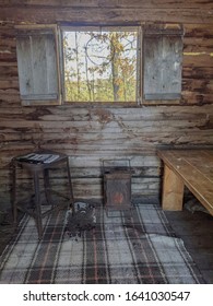 Inside of an old rustic simple log cabin 