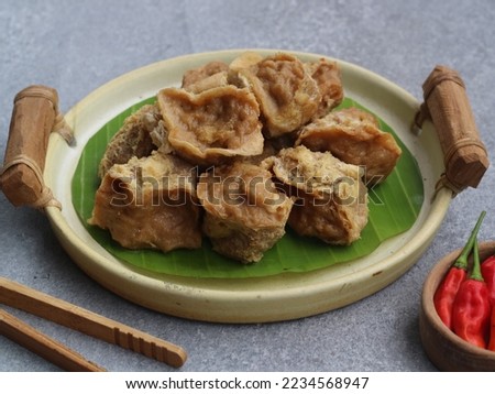 inside out tofu (tahu walik) is snack from banyuwangi region, east java, indonesia. made from fried tofu filled with meatball dough 