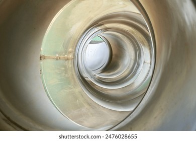 Inside part of gray colored round slide toy tunnel hole isolated on horizontal ratio full frame background.