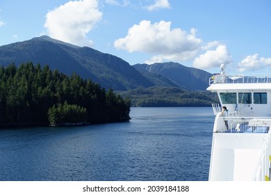 Inside Passage, British Columbia, Canada - August 24th, 2021: People admiring the beautiful blue ocean along the BC ferries inside passage route on the British Columbia coast , Canada.
