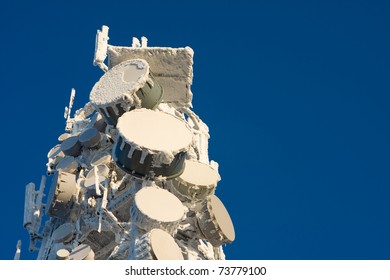 Inside perspective of a tall communications tower in snow day