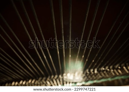Inside the piano. Strings inside the upright piano.