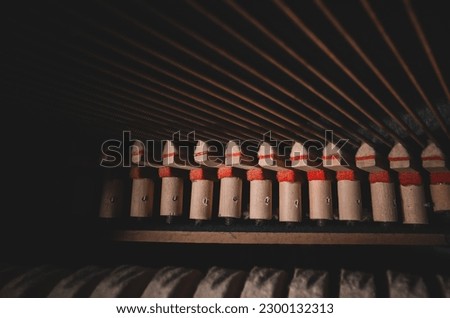 Inside the piano. Strings inside the upright piano.
