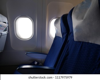 Inside the plane cabin panel with plane's window, plane's seats for wallpaper,background,backdrop of inside transportation vehicle (airplane,plane,areoplane)
