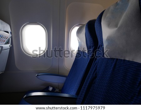 Inside the plane cabin panel with plane's window, plane's seats for wallpaper,background,backdrop of inside transportation vehicle (airplane,plane,areoplane)