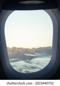 inside the plane, looking through a window 