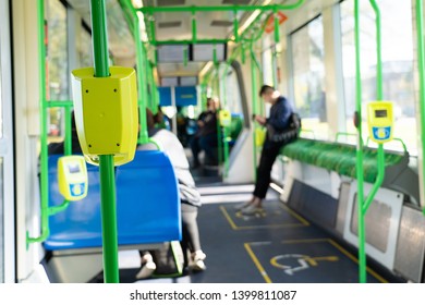 Inside The Public Transport Showing The Tap Card Machine On People Background. 