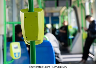 Inside The Public Transport Showing The Tap Card Machine On People Background. 