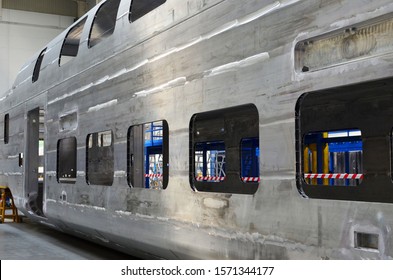 Inside Of The Rail Car Assembly Plant. Industrial Workshop For Welding Aluminum Bodys. Factory Of The Manufacturing Train Sets Rolling Stock And European High Speed Trains. 